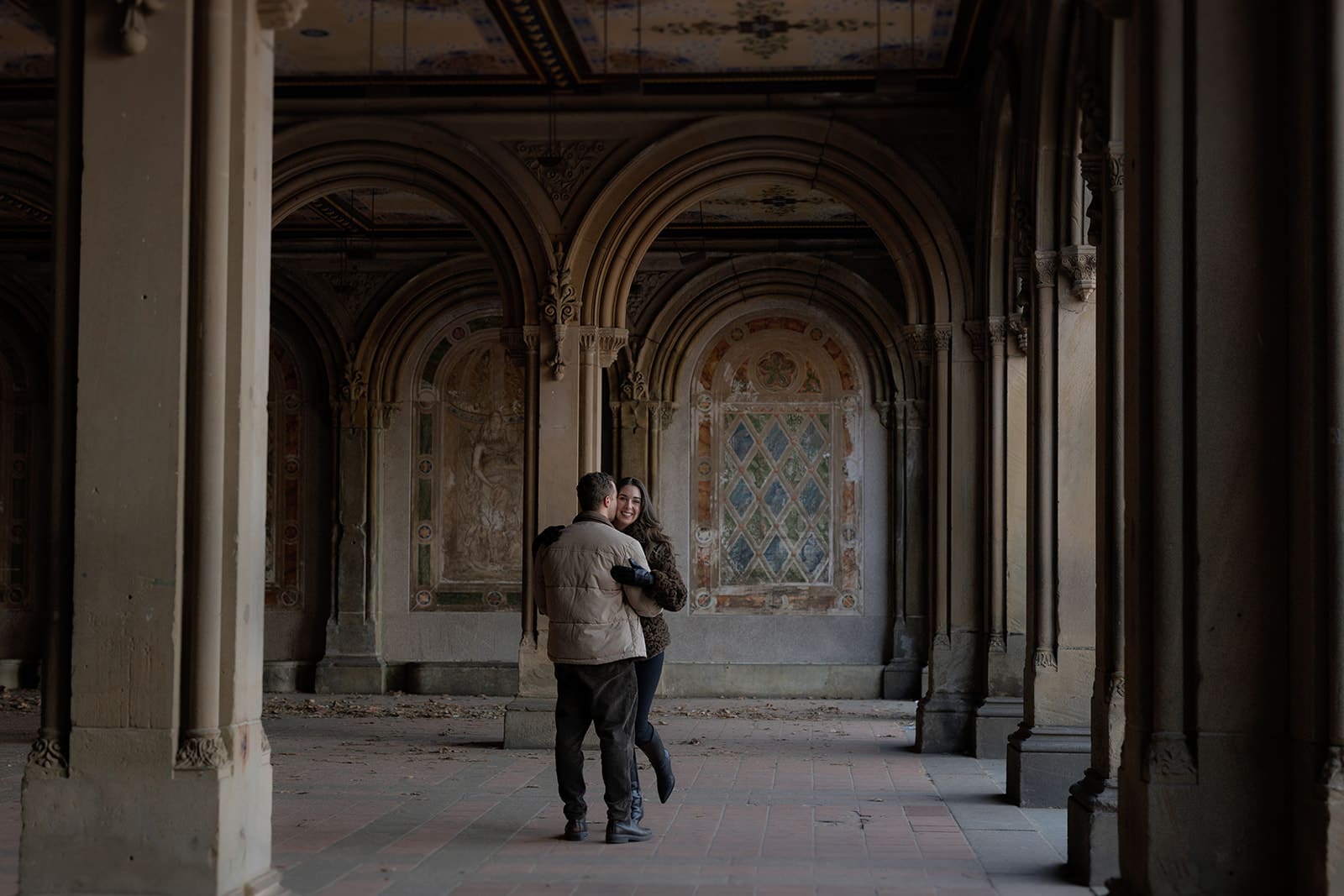 Wide photograph of Carlie and Mat inside the Bethesda Terrace Arcade in Central Park