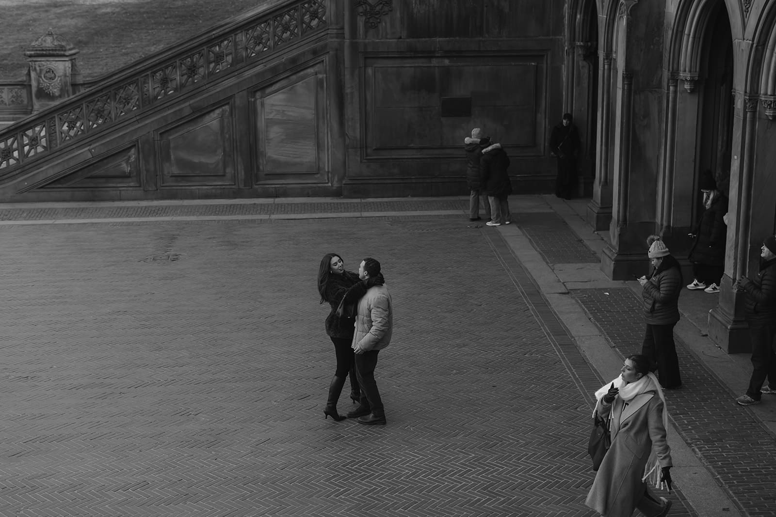 Carlie and Mat overlooking Bethesda Terrace during their Central Park winter session