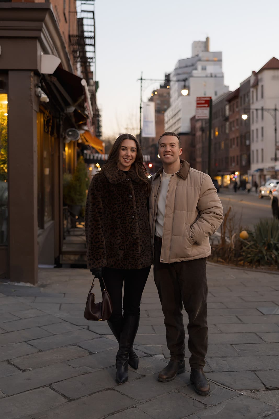 Carlie and Mat together on a downtown New York street at the end of their winter session