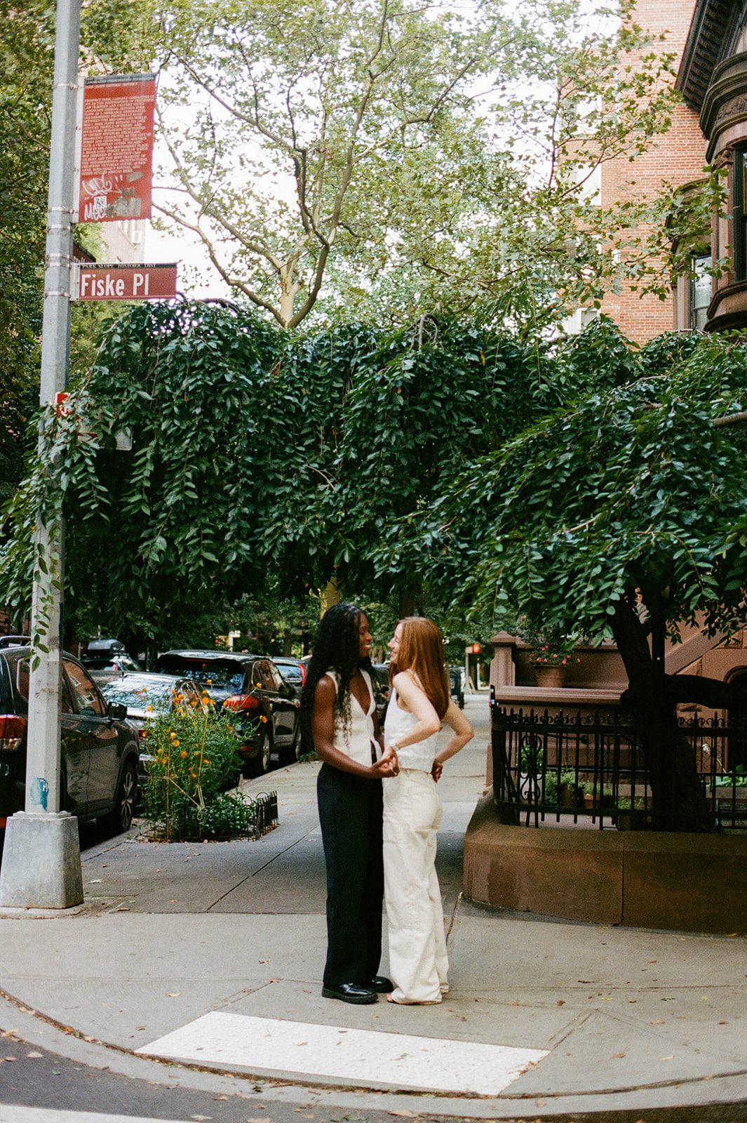 Cassia and Laura on a leafy Park Slope corner photographed on 35mm film