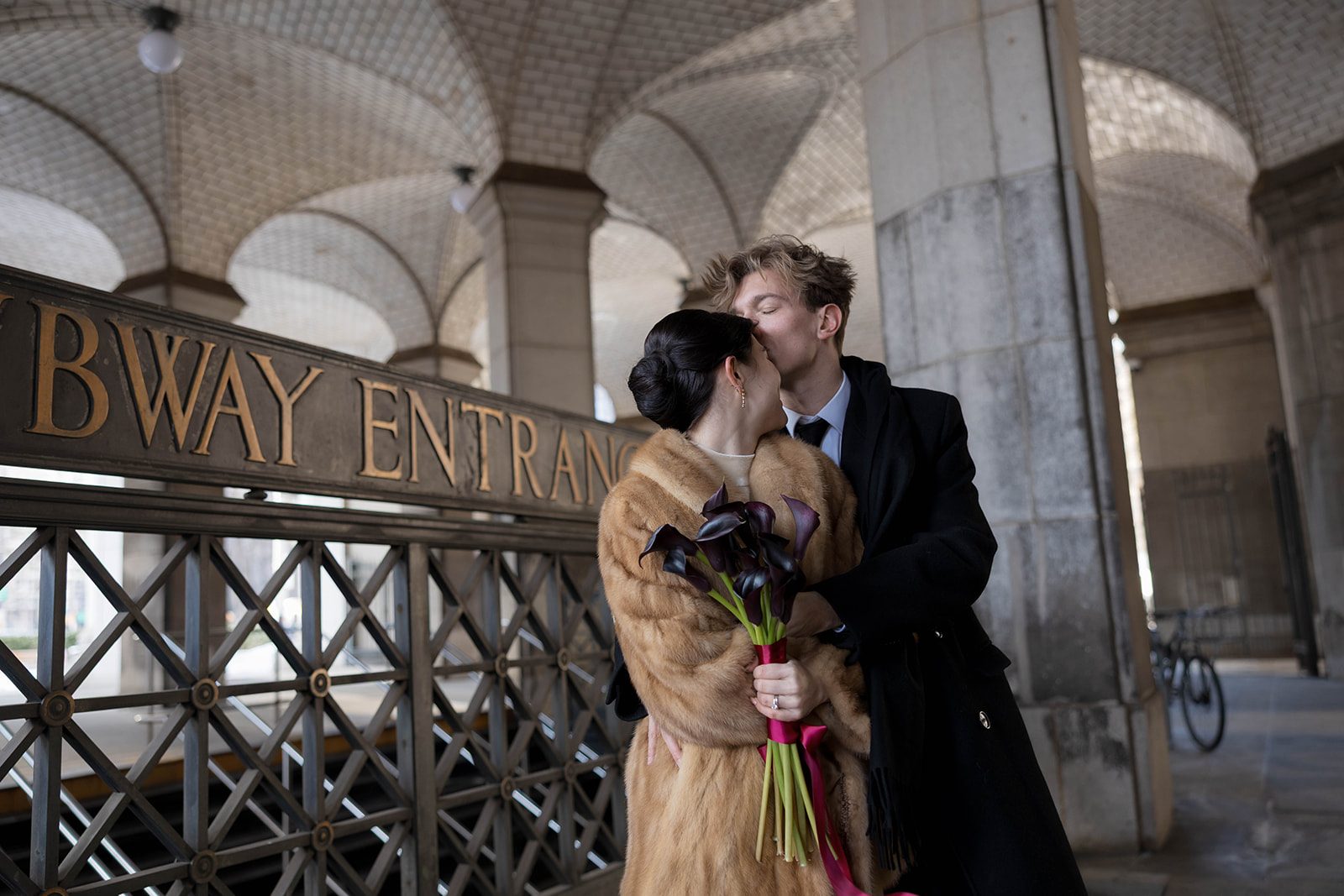 Claire and Andrey kissing outside Chambers Street Station after their New York City Hall elopement
