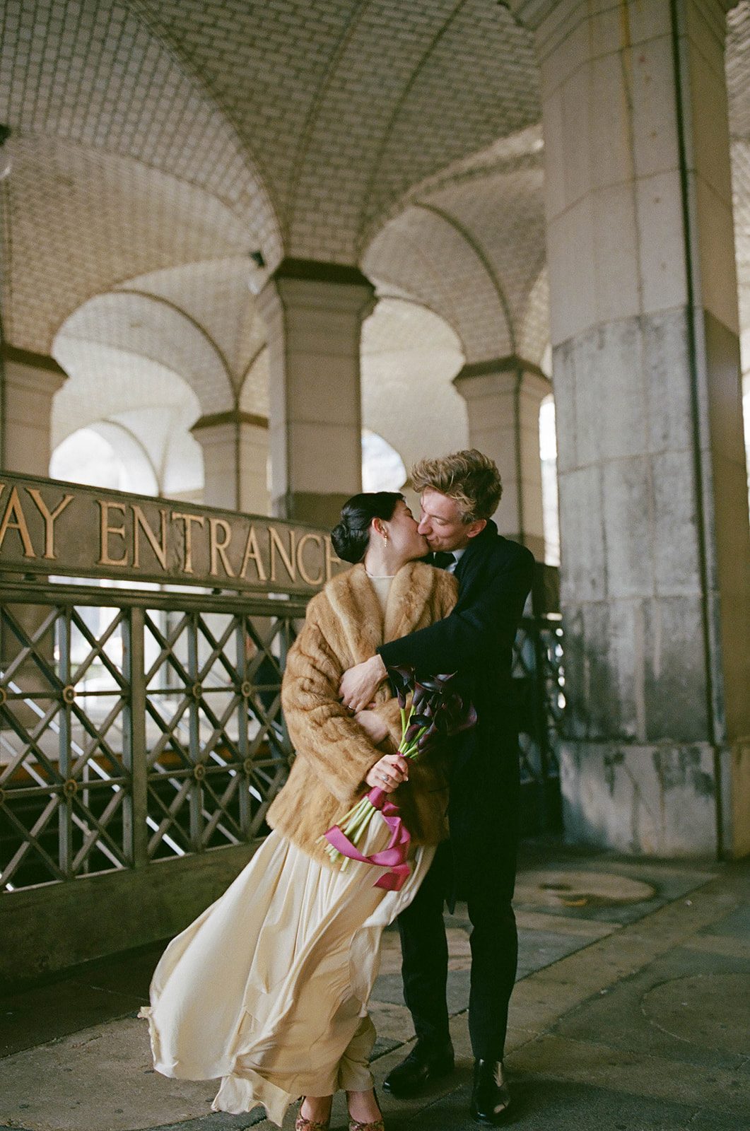 Claire and Andrey outside Chambers Street Station after their New York City Hall elopement, photographed on 35mm film
